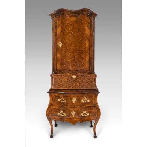 A German gilt-bronze mounted walnut and fruitwood bureau-cabinet. The parquetry-inlaid upper section enclosing a painted shelved interior over a conforming fall, and two banded drawers, with shaped apron, on angular cabriole legs. Circle of Abraham Roetgen, Rhineland, possibly Coblenz, 1750 circa.